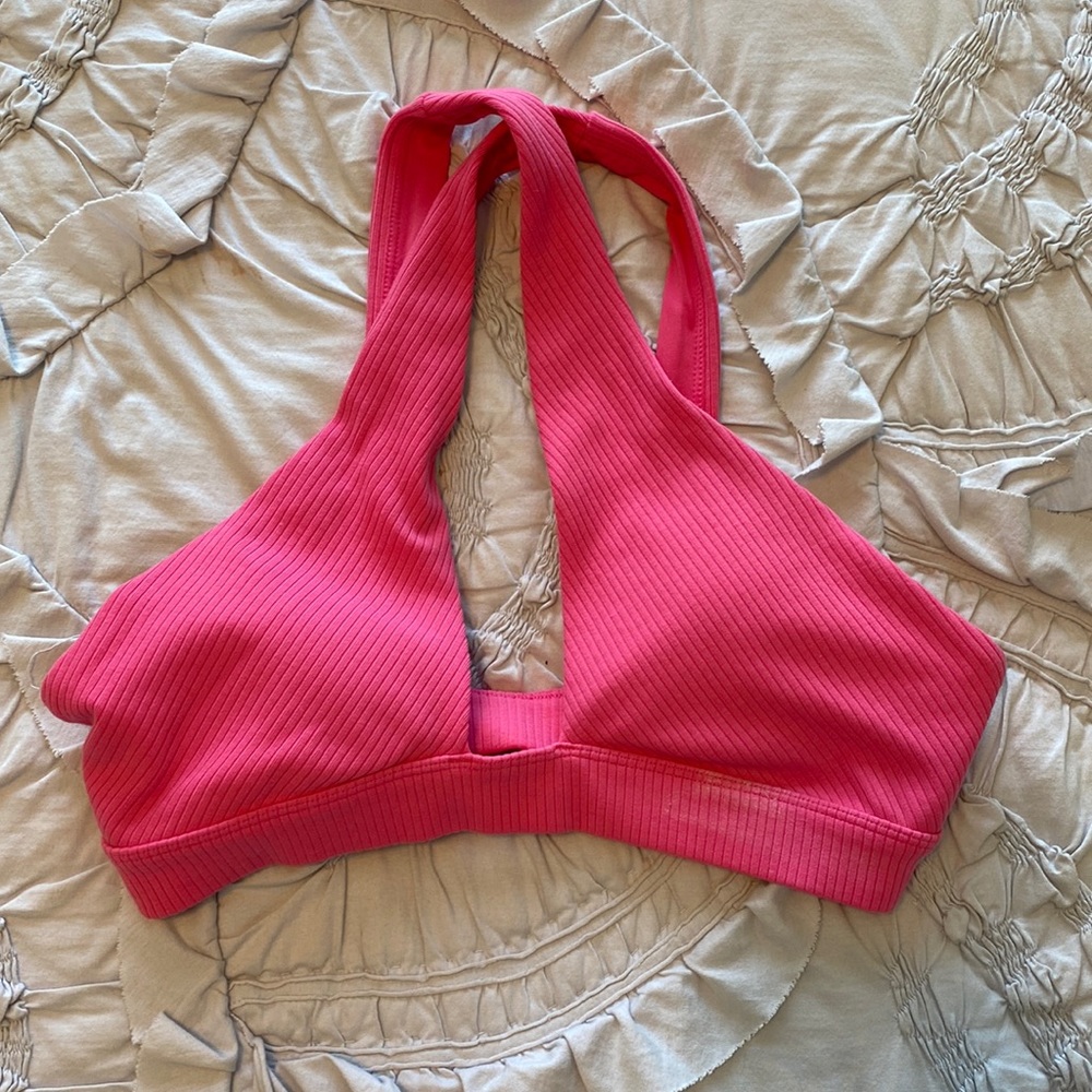 hot pink Alo Yoga sports bra